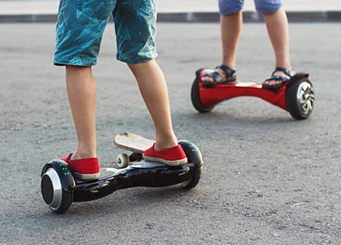 Two kids on hoverboards