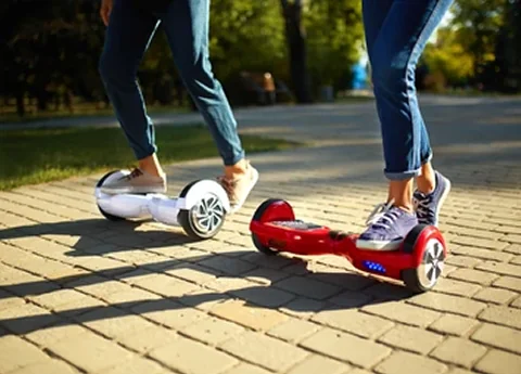 Two people riding hoverboards
